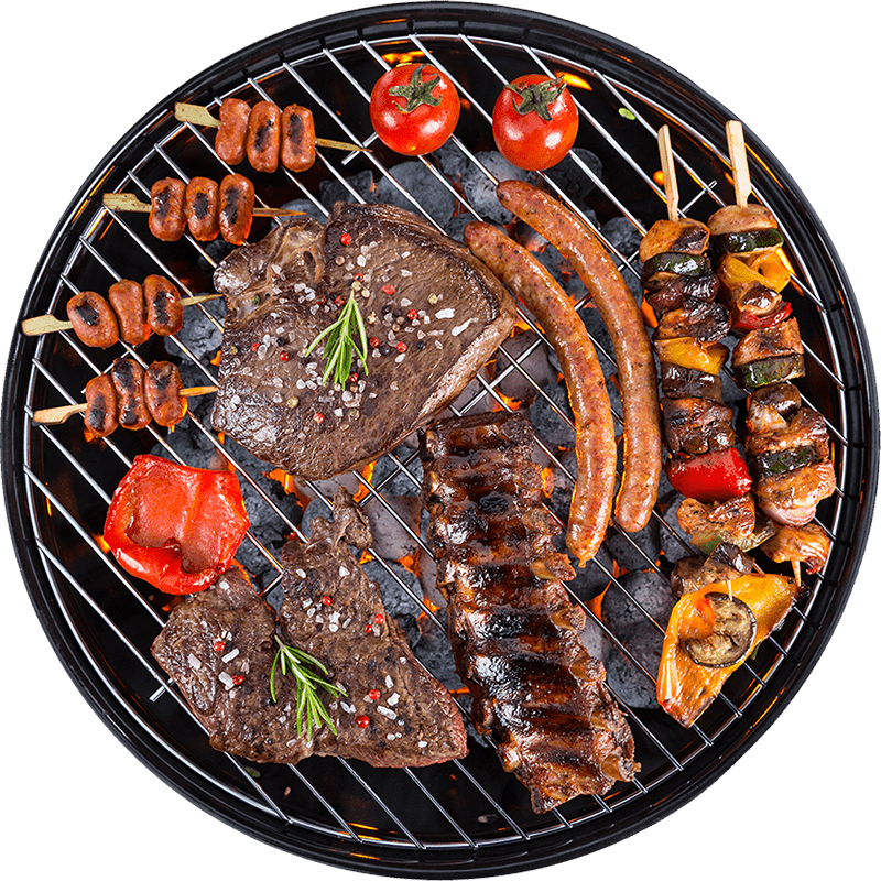 A grill loaded with grilled meats, vibrant vegetables, and skewers.