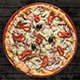  A delicious pizza topped with meat, peppers, and olives, elegantly placed on a rustic wooden table.